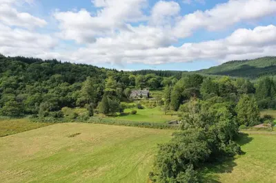 an aerial view of a house in the middle of a field at Tarbert Country Manor in Tarbert