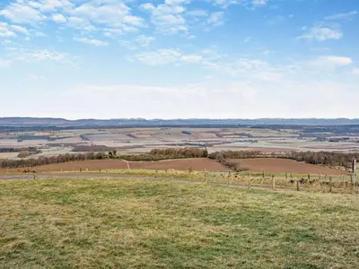 a view of a field from the top of a hill at 1 Bed in Dunning oc-ca333 in Dunning