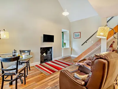a living room with a couch and a table at 1 Bed in Dunning oc-ca333 in Dunning