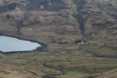 an aerial view of a mountain with a body of water at Barrachandroman Farmhouse in Lochbuie