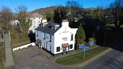 an aerial view of a white house on a street at The Kempock in Gourock
