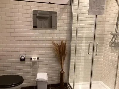 a bathroom with a glass shower and a toilet at The Townhouse Ayr - Luxury B&B - adults only in Ayr