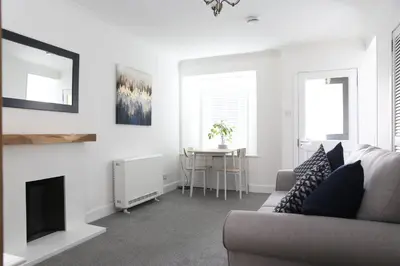 a living room with a couch and a table at Bank Place in Crieff