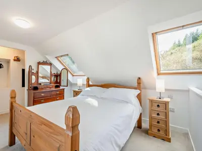 a bedroom with a large bed and a window at 1 Bed in Inveraray 91310 in Crarae