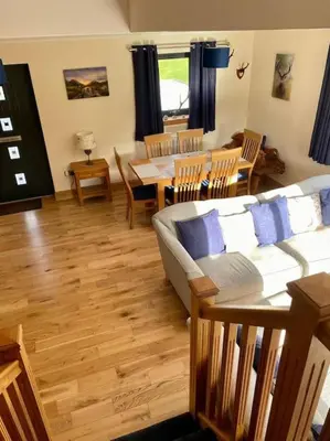 a living room with a couch and a table at Scottish Highland house Fort William in Corran