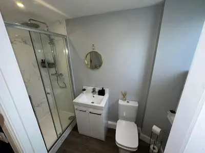 a bathroom with a shower and a toilet and a sink at The Gate House - 3 Bed & Parking in Edinburgh