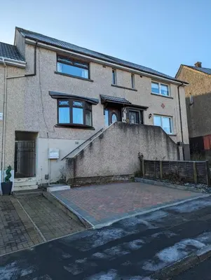 a brick house with a staircase in front of it at Lovely 2 Bedroom Terrace House in Coatbridge