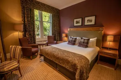 a hotel room with a bed and a window at Crieff Hydro in Crieff