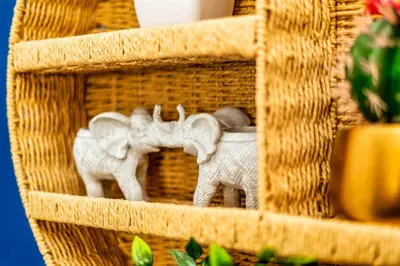 two figurines of elephants on a wicker basket at Sleek and Stylish 3 Bed in Greenock - Sleeps 8 in Greenock