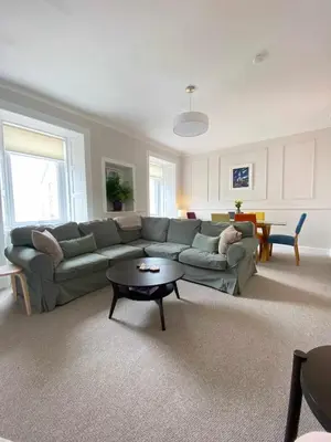 a living room with a couch and a table at Waverley Apartments, The Wheelhouse in Gourock