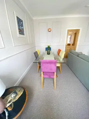 a living room with a table and a couch at Waverley Apartments, The Wheelhouse in Gourock