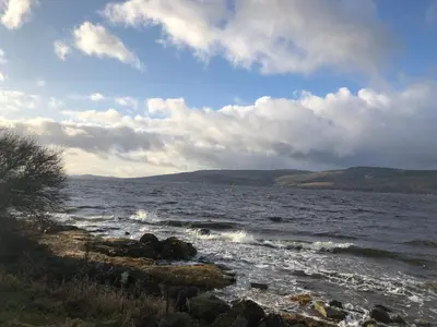 a view of a body of water with waves at Waverley Apartments, The Wheelhouse in Gourock