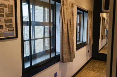 a hallway with two windows in a room at CODE - The Loft, Edinburgh in Edinburgh
