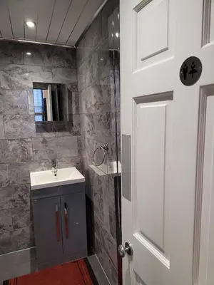 a bathroom with a sink and a shower at Luxe rooms in Edinburgh