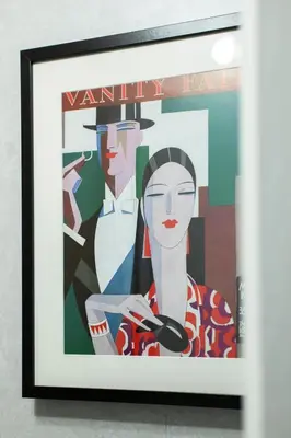 a framed painting of a man and a woman at Trendy 2 Bed Flat - Near Airport in Broxburn