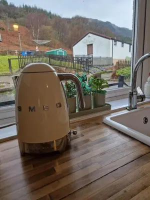 a mixer sitting on a kitchen counter next to a window at Langview in Arrochar