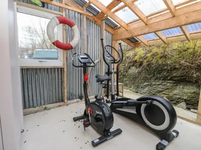 a gym with two exercise bikes in a room at The Pier House in Lochgilphead