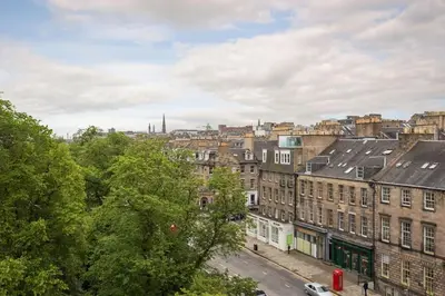 a view of a city with buildings and trees at Prime Edinburgh City Centre - 4 Bed Penthouse in Edinburgh
