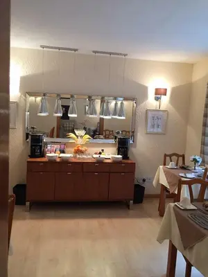 a room with a counter with a large mirror at Southfork Villa Guesthouse in Callander