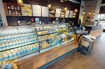 a store with a lot of bottles of water on display at Village Hotel Edinburgh in Edinburgh