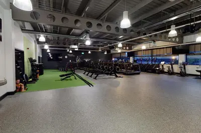 a gym with a lot of exercise equipment in it at Village Hotel Edinburgh in Edinburgh