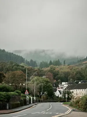 an empty road in a small town on a mountain at Jameswood Villa in Sandbank