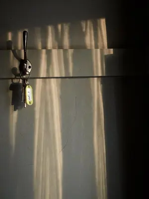 a metal refrigerator with a tag on top of it at Jameswood Villa in Sandbank