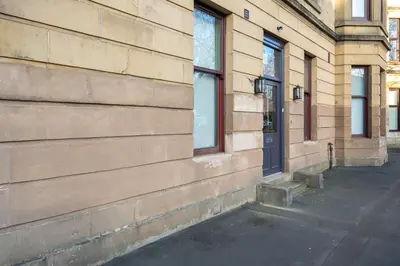 a building with a door on the side of it at Bluebell Studio Glasgow Airport in Paisley