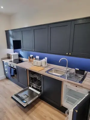 a kitchen with a sink and a counter top at The Rail & Ferry Den in Oban