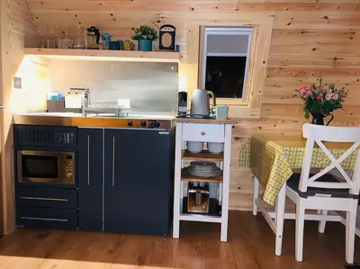 a kitchen with a stove and a counter top at The Pod Over By in Kilmichael Glassary