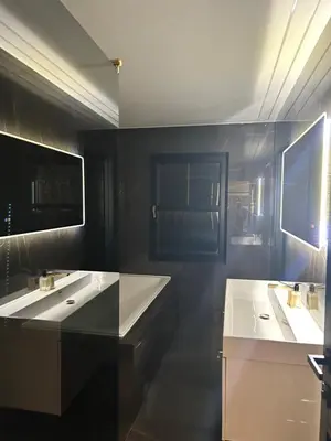 a bathroom with two sinks and two mirrors at Large Modern Family Home in Murrayfield - Very close to City Centre - 10 mins by Direct Bus - Private Driveway & Garden in Edinburgh