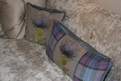 two pillows sitting on top of a couch at Grassmarket Studio in Edinburgh
