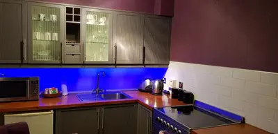 a kitchen with a sink and a stove top oven at Grassmarket Studio in Edinburgh