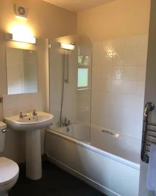 a bathroom with a sink and a tub and a toilet at Bracken Lodges, Loch Tay, Linnie Lodge in Aberfeldy