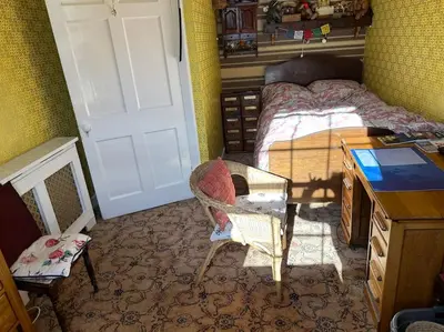 a bedroom with a bed and a desk and a desk at Very central 2 bedroom flat in World Heritage Site in Edinburgh