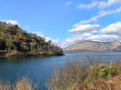 a view of a lake with mountains in the background at Bayview in Kentallen