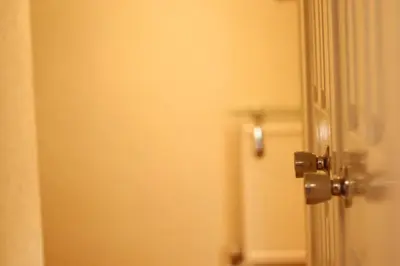 a bathroom door with a door knob on it at 3 Bedrooms Flat in Central Edinburgh Old Town Sleeps 6 in Edinburgh