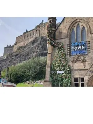 a building with a sign on the side of it at 3 Bedrooms Flat in Central Edinburgh Old Town Sleeps 6 in Edinburgh