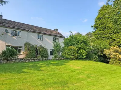 a house with a large lawn in front of it at Bridge Park in Killin