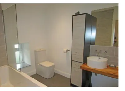a bathroom with a sink and a toilet at Oban Lorne Apartment in Oban