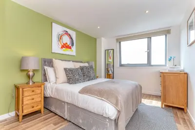 a bedroom with a bed and a window at SECC Hydro Executive 7 Apartment in Glasgow