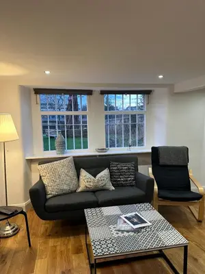 a living room with a couch and a table at The Inverleither in Edinburgh
