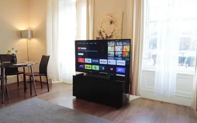 a flat screen tv sitting in a living room at 1 Bedrooms Flat in Central Edinburgh Haymarket, Heart of Edinburgh Flat Sleeps 4 in Edinburgh