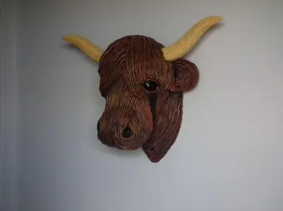 a wooden animal head with horns on a wall at Borrowmoss Bothy, Charming & Characterful property, Wigtown in Wigtown