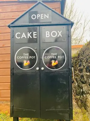 an open cake box with two stickers on it at Argyll House Pennyghael in Salen