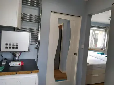a room with a room with a bed and a mirror at Double Ensuite room, 1-minute walk to bus stop in Edinburgh