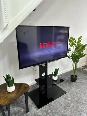 a television with the netflix sign on top of it at Stylish home in Linlithgow Near Edinburgh Airport Free parking Free WiFi in Linlithgow