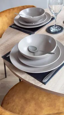 a table with white plates and a spoon on it at Airth House in Airth