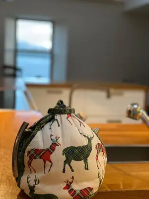 a vase with horses on it sitting on a table at Tigh na Breac - Great Outdoor Activity Location Oban in Bonawe