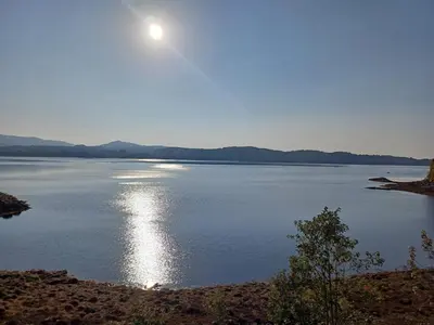 a large body of water with the sun in the sky at Tigh na Breac - Great Outdoor Activity Location Oban in Bonawe